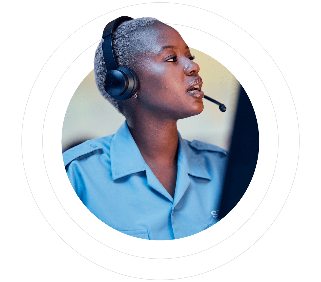 Woman with short hair wearing a headset, working as a dispatcher.