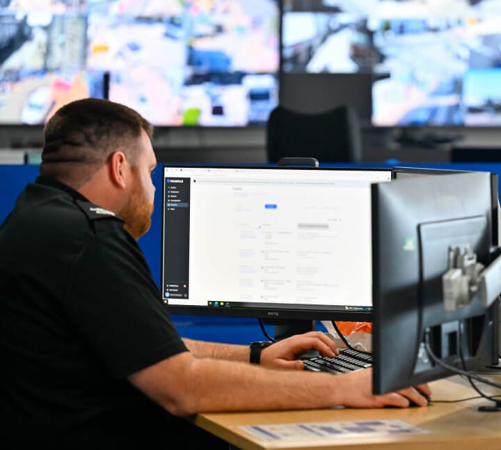 a police officer working at his computer in the office