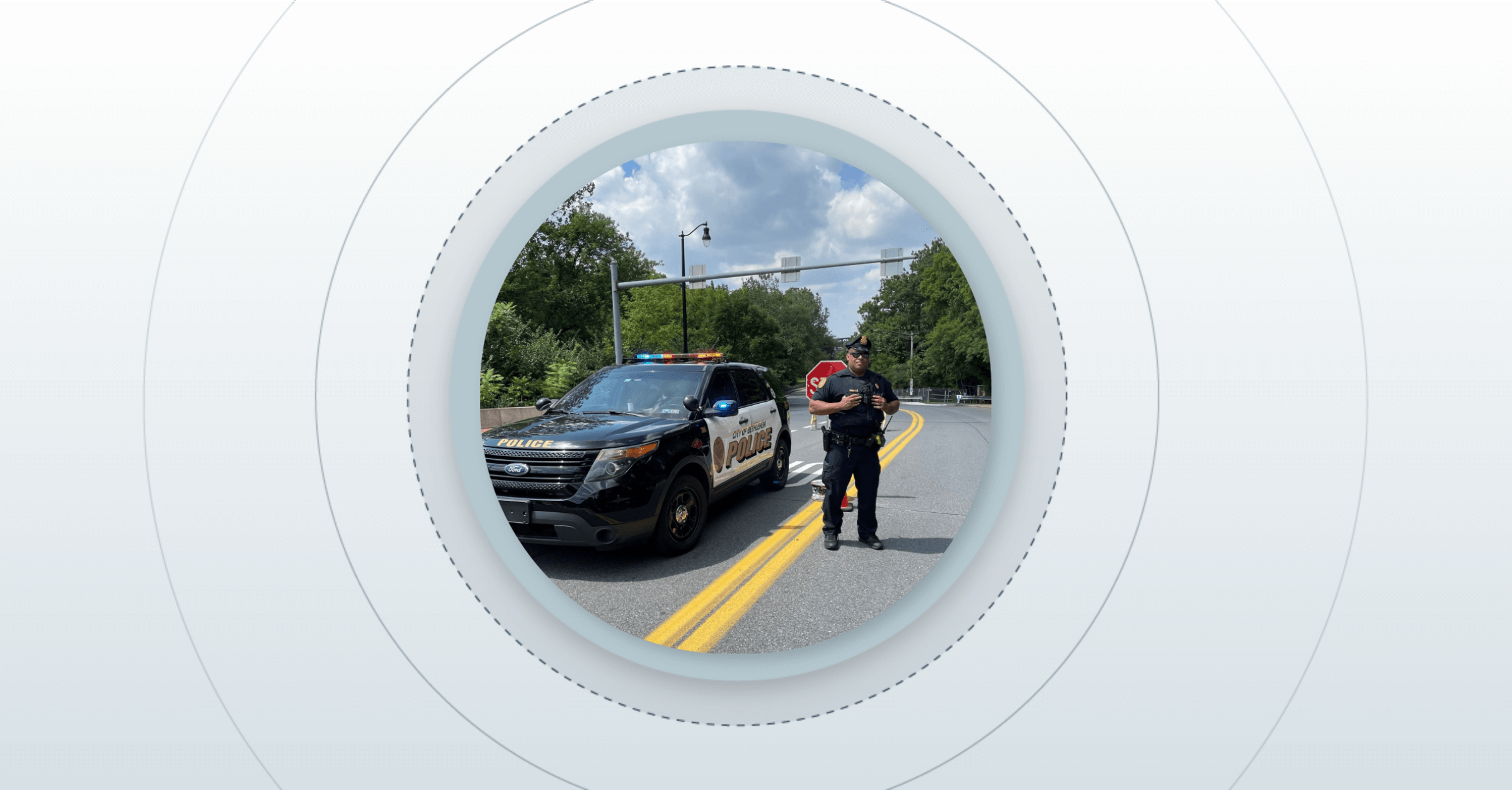 police officer standing next to his vehicle