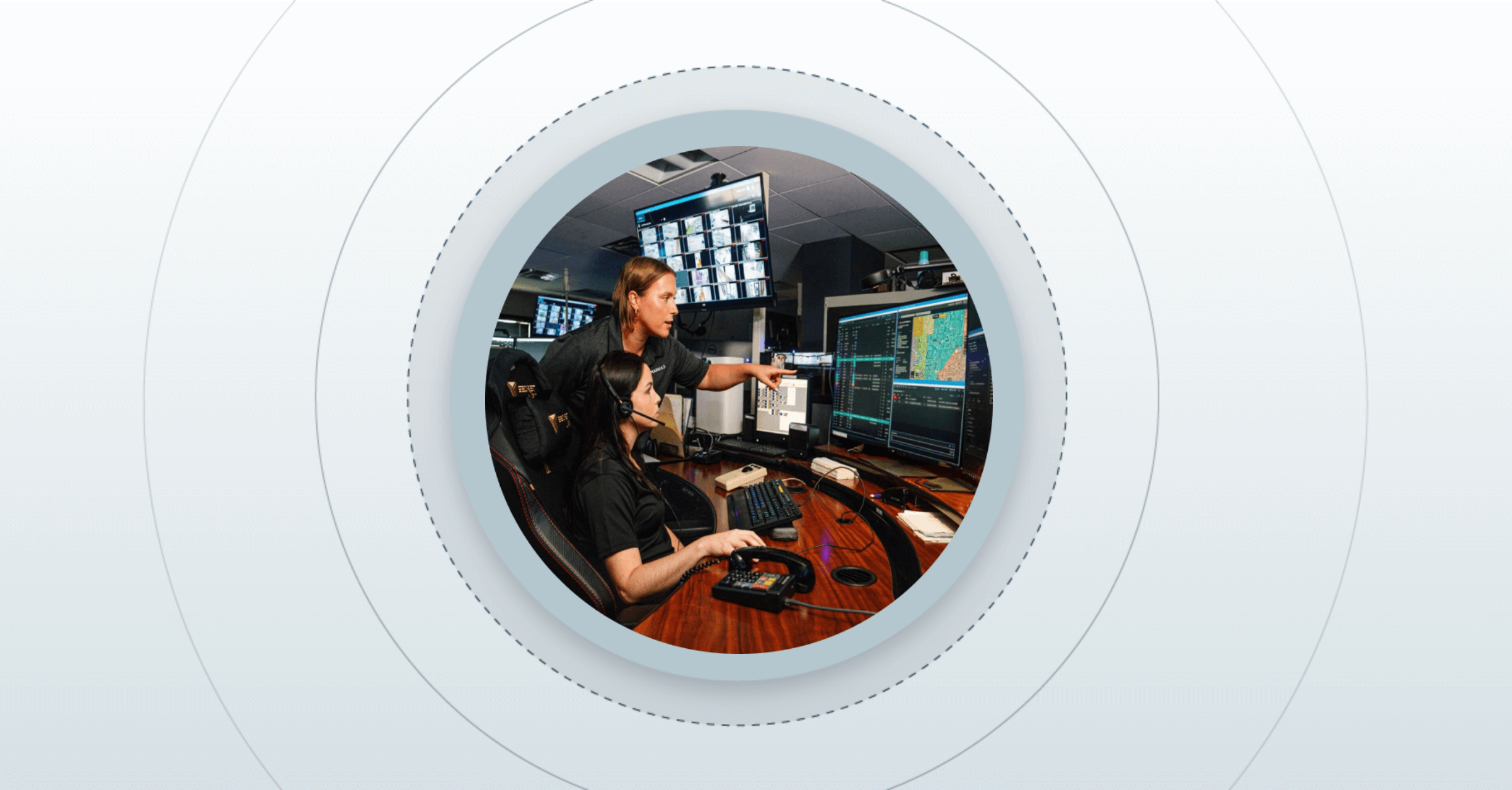 two dispatchers working on the computer together